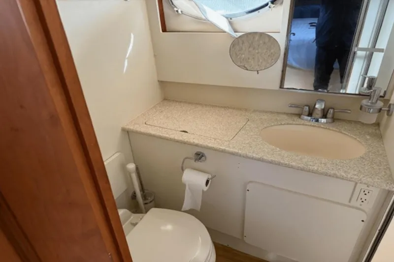 Slide: The Image of Bathroom interior of 2001 Silverton 392 Motoryacht with sink and toilet. - 32