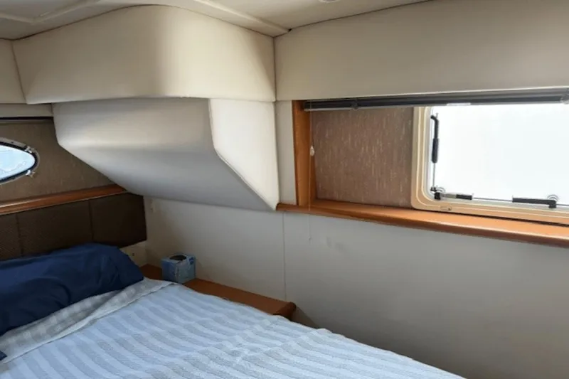 Slide: The Image of Interior cabin of 2001 Silverton 392 Motoryacht with bed and window. - 34