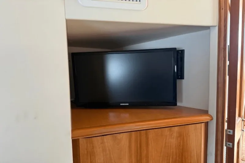 Slide: The Image of TV in 2001 Silverton 392 Motoryacht interior, mounted on wooden cabinet. - 38