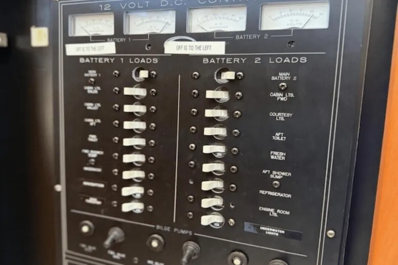 Slide: The Image of Control panel of a 2001 Silverton 392 Motoryacht, showing battery and load switches. - 50