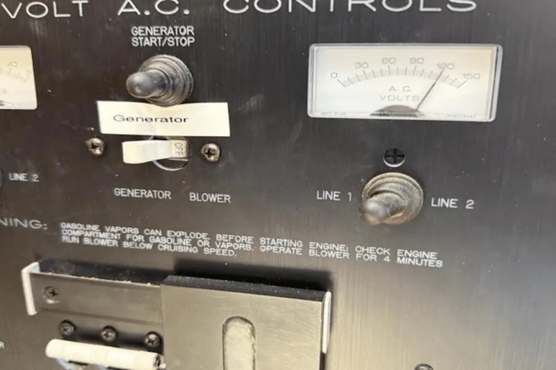 Slide: The Image of Control panel of a 2001 Silverton 392 Motoryacht with generator and voltage indicators. - 52