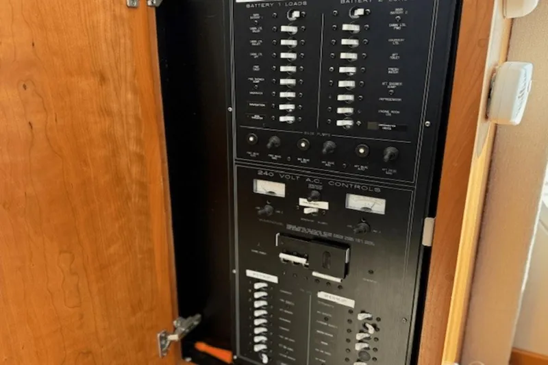 Slide: The Image of Electrical control panel inside a 2001 Silverton 392 Motoryacht. - 53