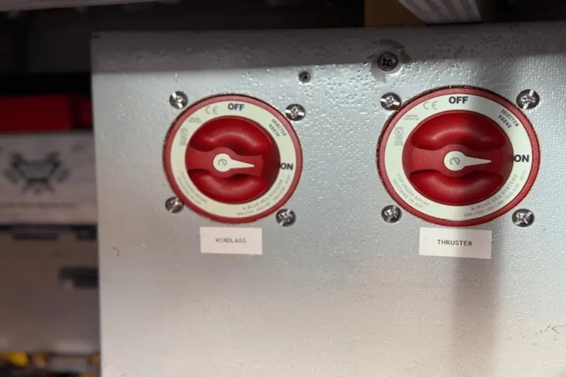 Slide: The Image of Red switches labeled "Windlass" and "Thruster" on a 2001 Silverton 392 Motoryacht. - 58