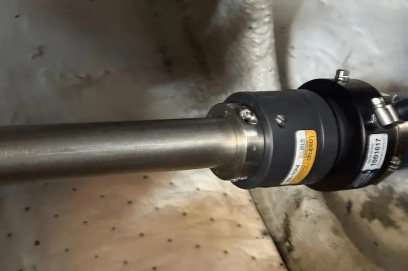 Slide: The Image of Close-up of a 2001 Silverton 392 Motoryacht propeller shaft and coupling. - 63