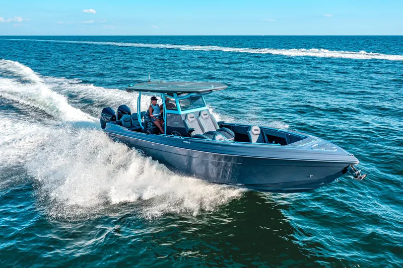 The Image of 2025 Glasstream 32 LS GSX boat cruising on open water, creating a dynamic wake. - 1
