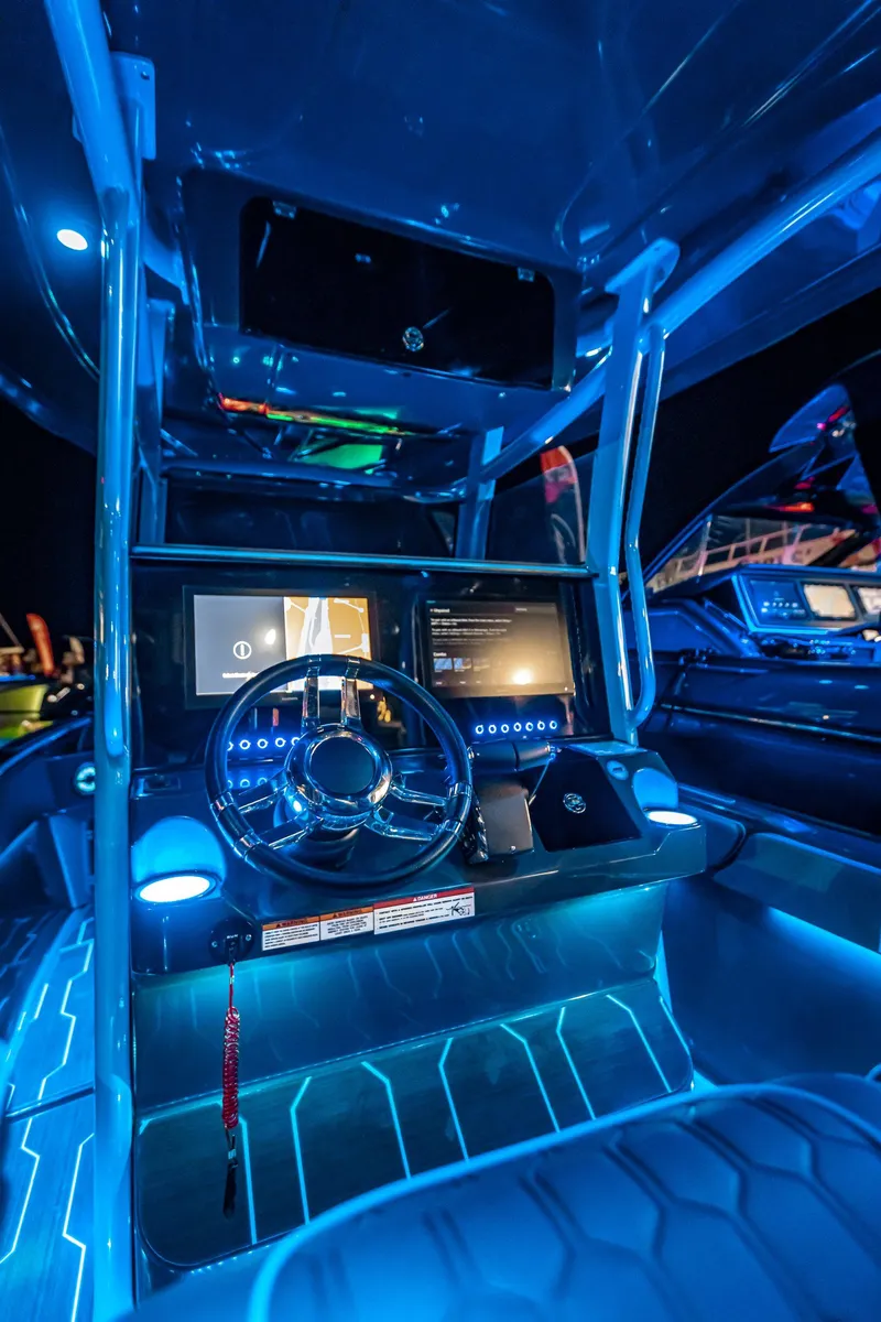 Slide: The Image of 2025 Glasstream 32 LS GSX boat interior with illuminated dashboard and modern controls. - 13