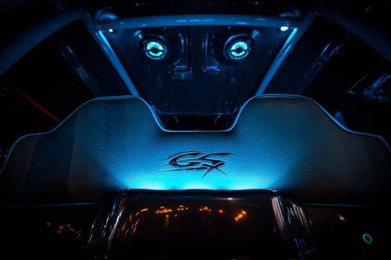Slide: The Image of 2025 Glasstream 32 LS GSX interior with blue ambient lighting and GSX logo. - 14