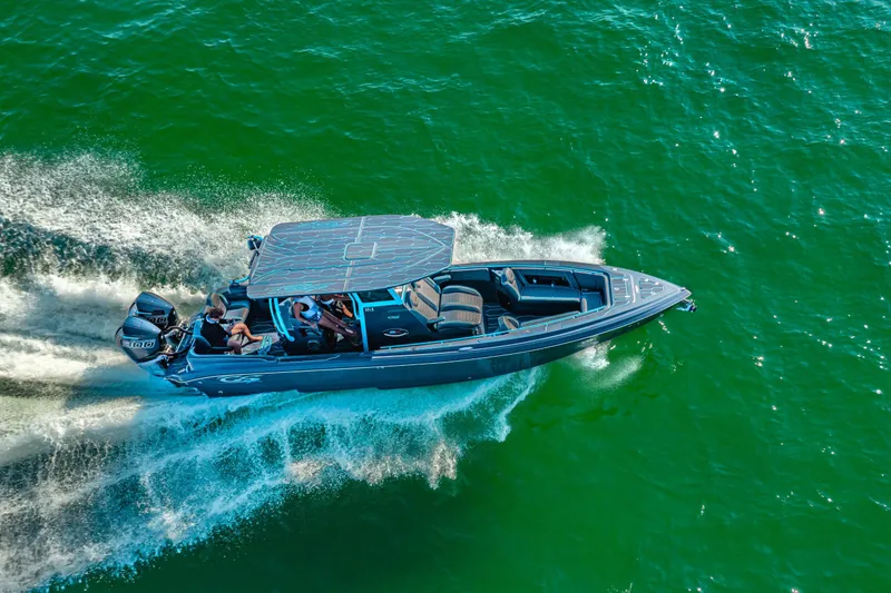 Slide: The Image of 2025 Glasstream 32 LS GSX boat cruising on vibrant green water. - 5