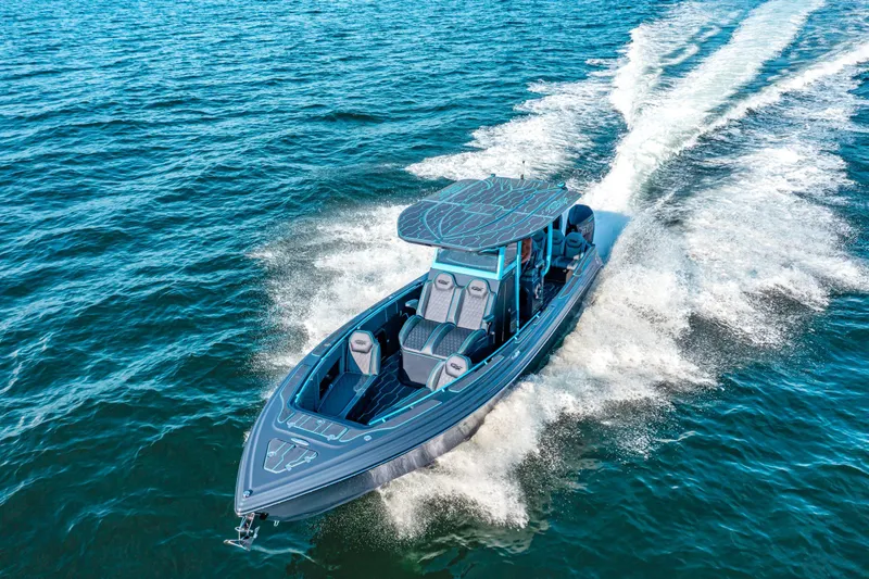 Slide: The Image of 2025 Glasstream 32 LS GSX boat cruising on open water, showcasing sleek design and performance. - 6