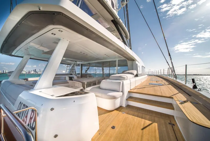 Slide: The Image of Luxurious 2020 Lagoon SEVENTY 7 yacht deck with modern seating and ocean view. - 13