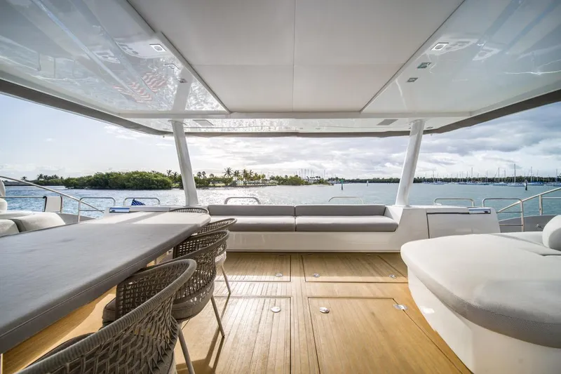 Slide: The Image of Luxurious 2020 Lagoon SEVENTY 7 yacht deck with ocean view and modern seating. - 14