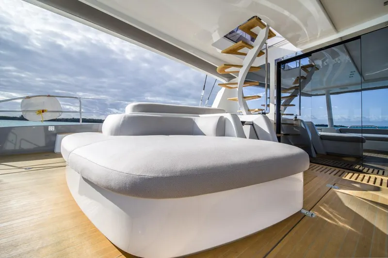 Slide: The Image of Luxurious 2020 Lagoon SEVENTY 7 yacht interior with modern seating and elegant staircase. - 21