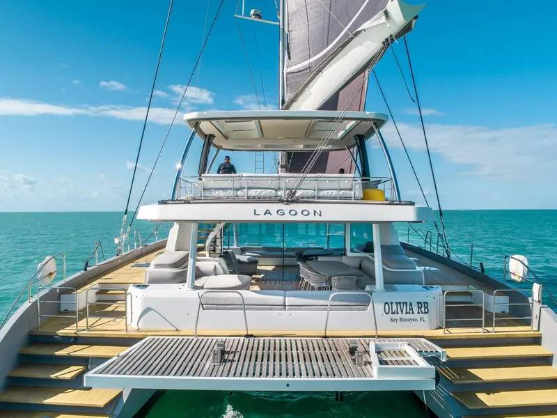 Slide: The Image of 2020 Lagoon SEVENTY 7 yacht sailing on turquoise waters under clear blue skies. - 3
