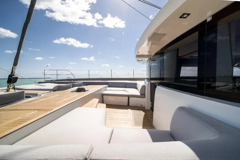 Slide: The Image of Luxurious 2020 Lagoon SEVENTY 7 yacht deck with modern seating and ocean view. - 32