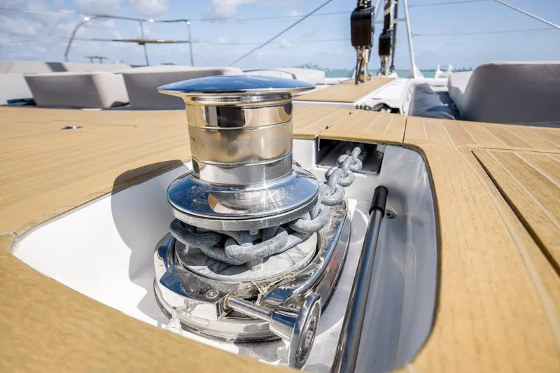 Slide: The Image of Anchor winch on 2020 Lagoon SEVENTY 7 yacht deck, showcasing polished metal and wood finish. - 37