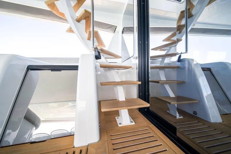 Slide: The Image of Interior staircase of 2020 Lagoon SEVENTY 7 yacht with wooden steps and modern design. - 39