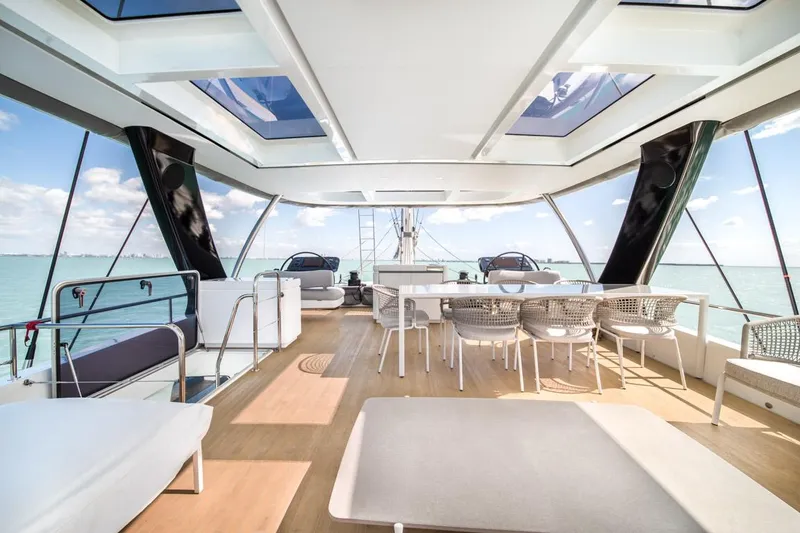Slide: The Image of Luxurious 2020 Lagoon SEVENTY 7 yacht interior with elegant seating and ocean view. - 44