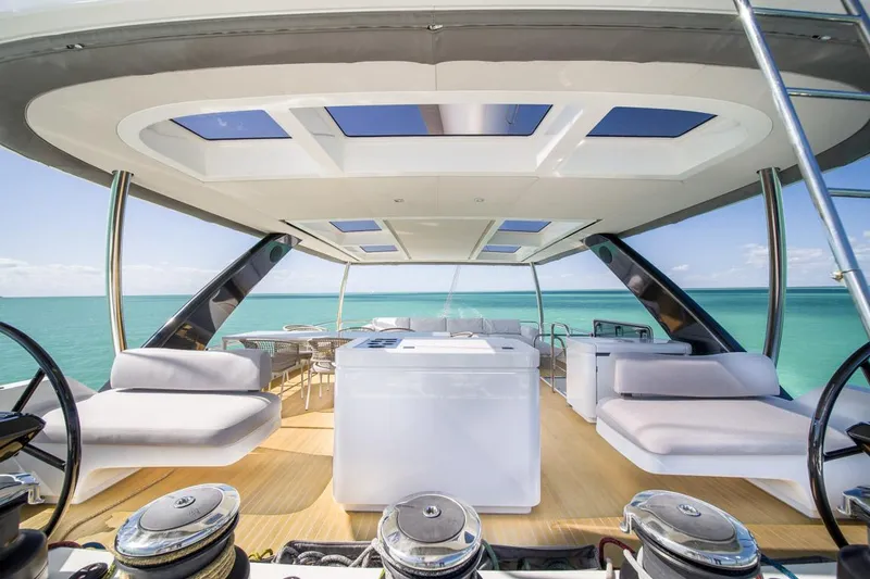 Slide: The Image of Luxurious 2020 Lagoon SEVENTY 7 yacht deck with modern seating and ocean view. - 45