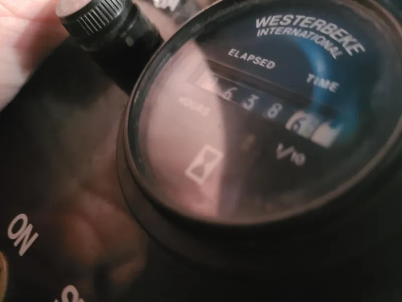 Slide: The Image of Close-up of a Westerbeke International gauge on a 1992 Four Winns Express Cruiser. - 23