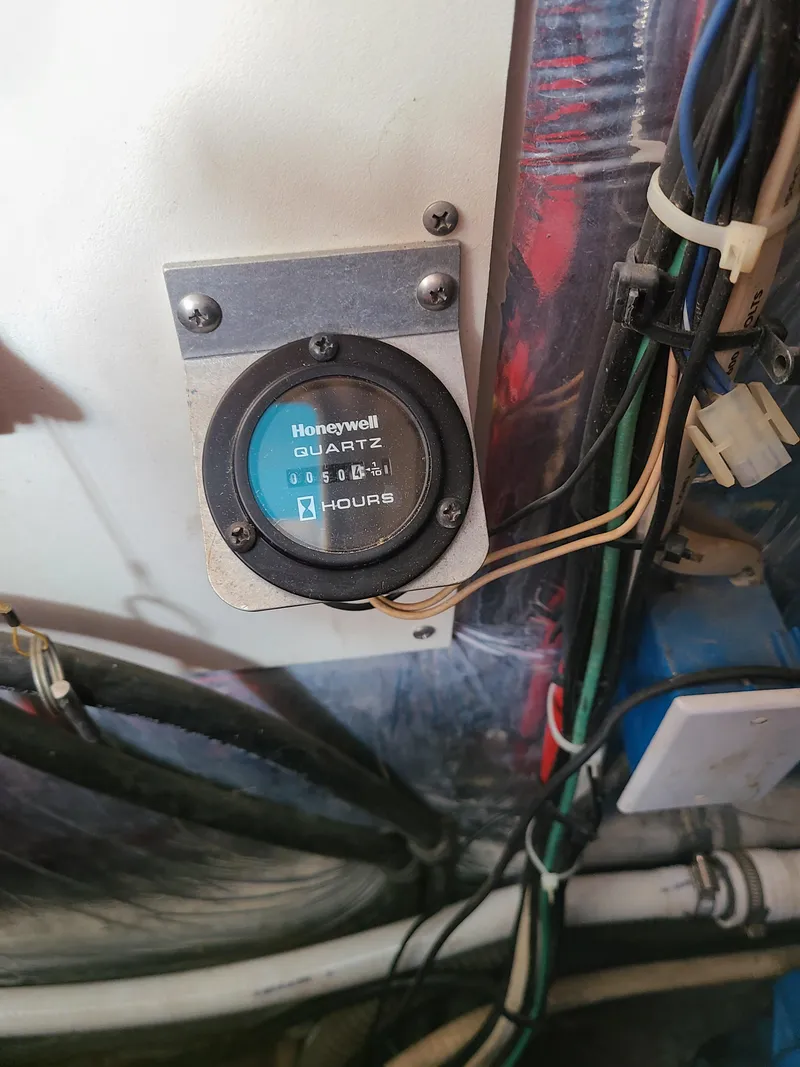 Slide: The Image of Hour meter in 1992 Four Winns Express Cruiser engine compartment. - 24