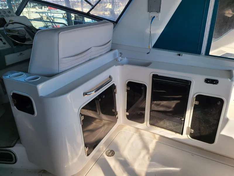 Slide: The Image of 1992 Four Winns Express Cruiser interior with seating and storage compartments. - 6