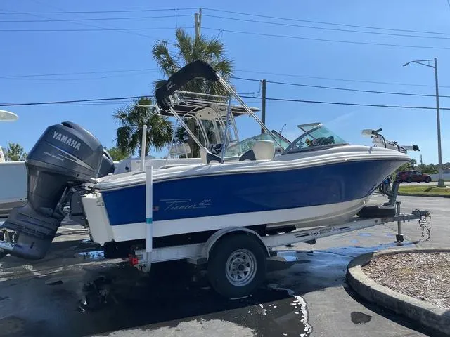 Slide: The Image of 2012 Pioneer 197 Venture boat with Yamaha engine on trailer, parked outdoors. - 1