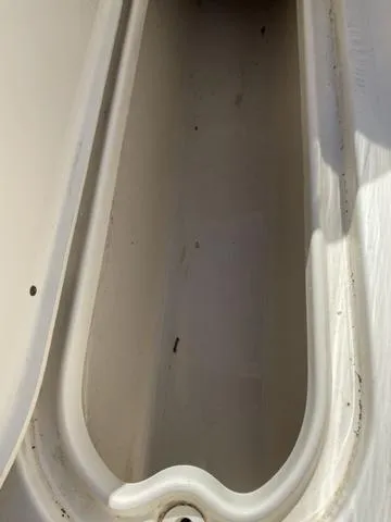 Slide: The Image of Storage compartment of a 2012 Pioneer 197 Venture boat, showing interior details. - 10