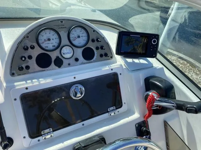 Slide: The Image of Control panel of a 2012 Pioneer 197 Venture boat with gauges and navigation system. - 11