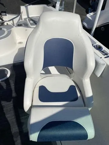 Slide: The Image of White and blue boat seat on a 2012 Pioneer 197 Venture. - 14