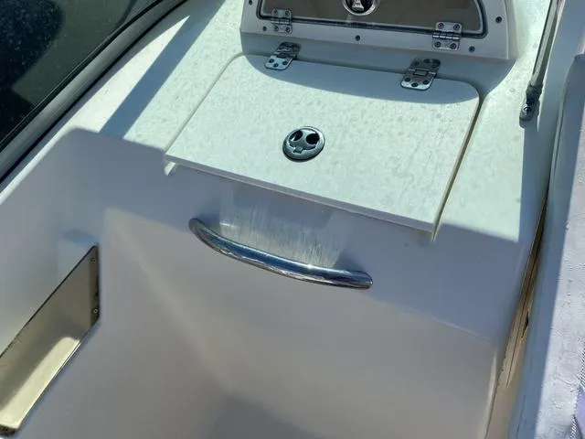 Slide: The Image of 2012 Pioneer 197 Venture boat with a closed hatch and stainless steel handle. - 15