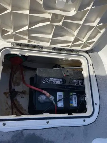 Slide: The Image of Battery compartment of a 2012 Pioneer 197 Venture boat, showing wiring and connections. - 20