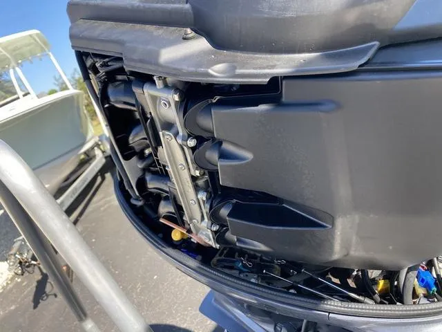 Slide: The Image of Close-up of a 2012 Pioneer 197 Venture boat engine, showcasing mechanical details. - 26