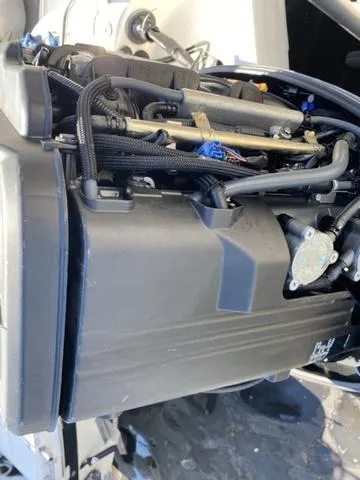 Slide: The Image of Close-up of a 2012 Pioneer 197 Venture engine, showcasing intricate components and wiring. - 27