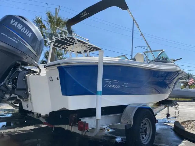 Slide: The Image of 2012 Pioneer 197 Venture boat with Yamaha engine on trailer, parked outdoors. - 3