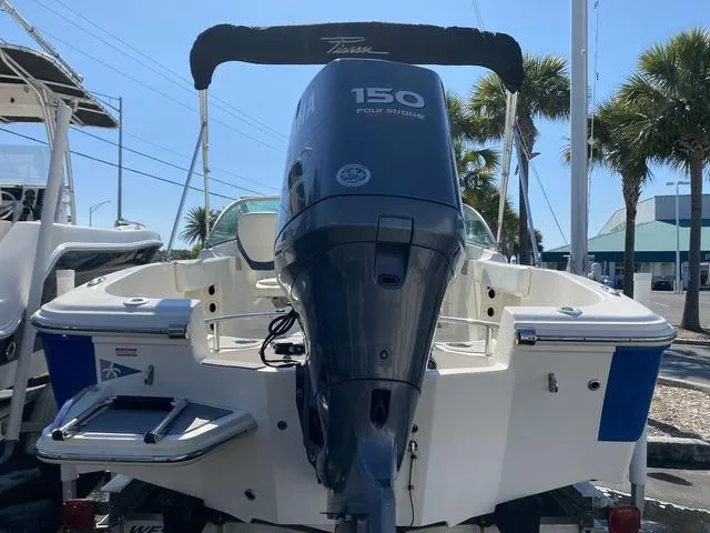 Slide: The Image of 2012 Pioneer 197 Venture boat with Yamaha 150 outboard motor, docked under clear blue sky. - 5