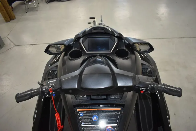 Slide: The Image of 2023 Yamaha WaveRunner FX SVHO® dashboard with audio system, featuring handlebars and display. - 13
