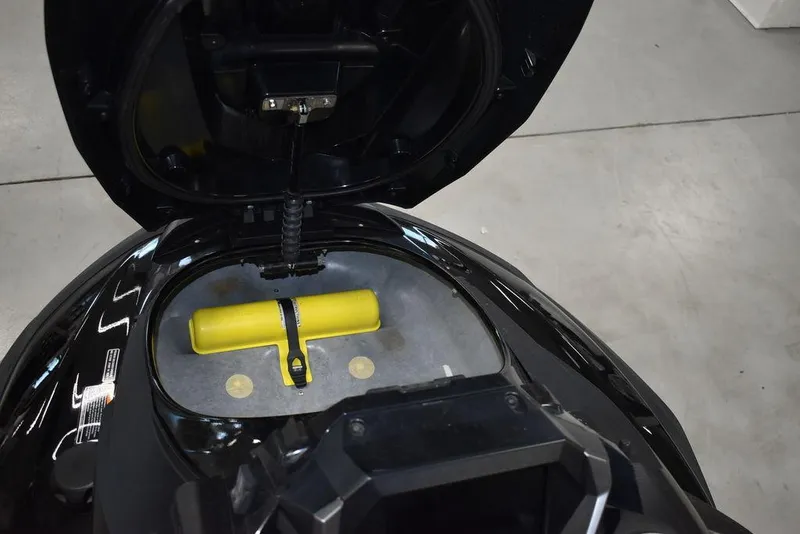 Slide: The Image of 2023 Yamaha WaveRunner FX SVHO® storage compartment with yellow safety equipment. - 29