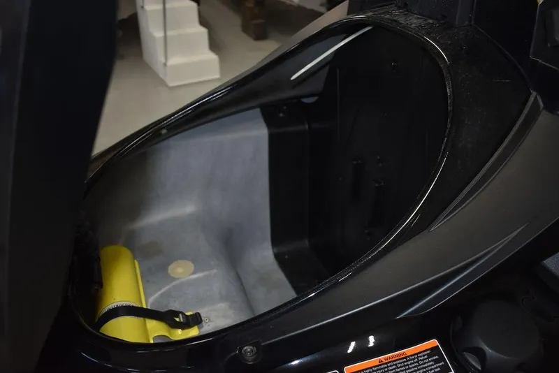 Slide: The Image of 2023 Yamaha WaveRunner FX SVHO storage compartment with audio system, open view. - 30