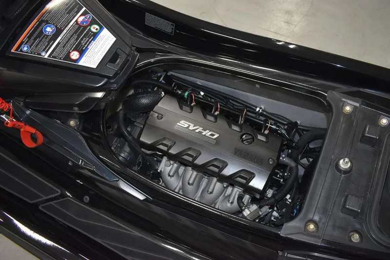 Slide: The Image of 2023 Yamaha WaveRunner FX SVHO engine compartment with audio system, showcasing sleek design. - 32