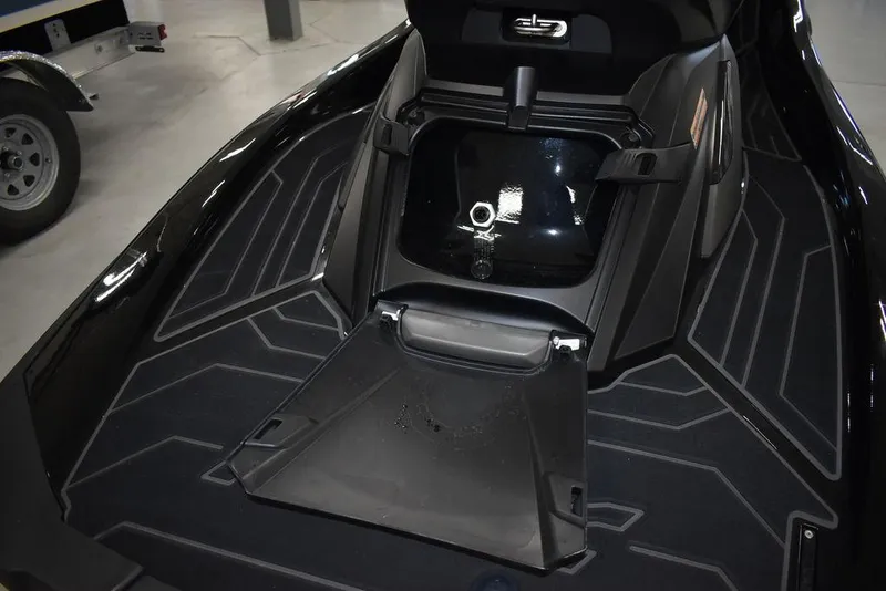 Slide: The Image of 2023 Yamaha WaveRunner FX SVHO® with Audio System, showcasing sleek black design and storage compartment. - 36
