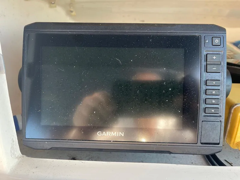 Slide: The Image of Garmin GPS device on 2001 Grady-White Gulfstream 232 boat dashboard. - 13