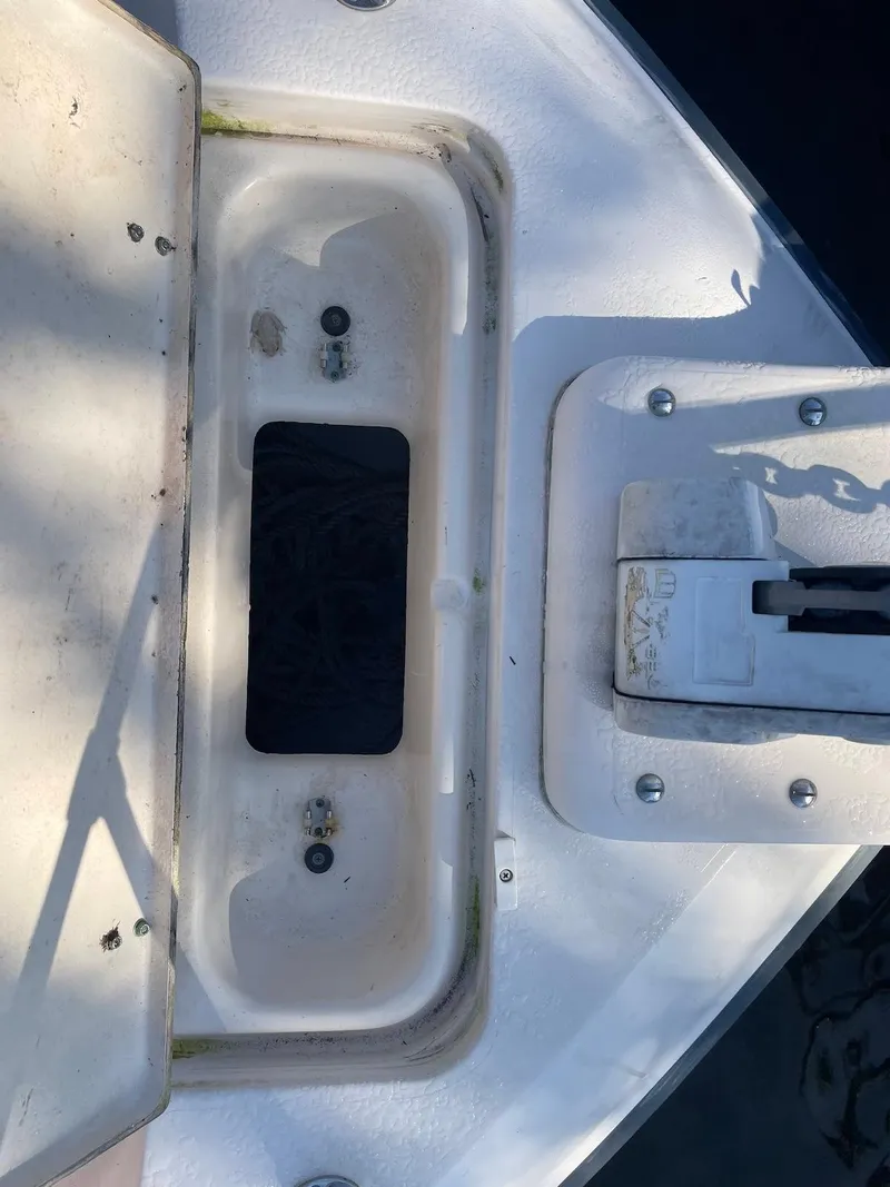 Slide: The Image of 2001 Grady-White Gulfstream 232 boat deck with open storage compartment. - 17