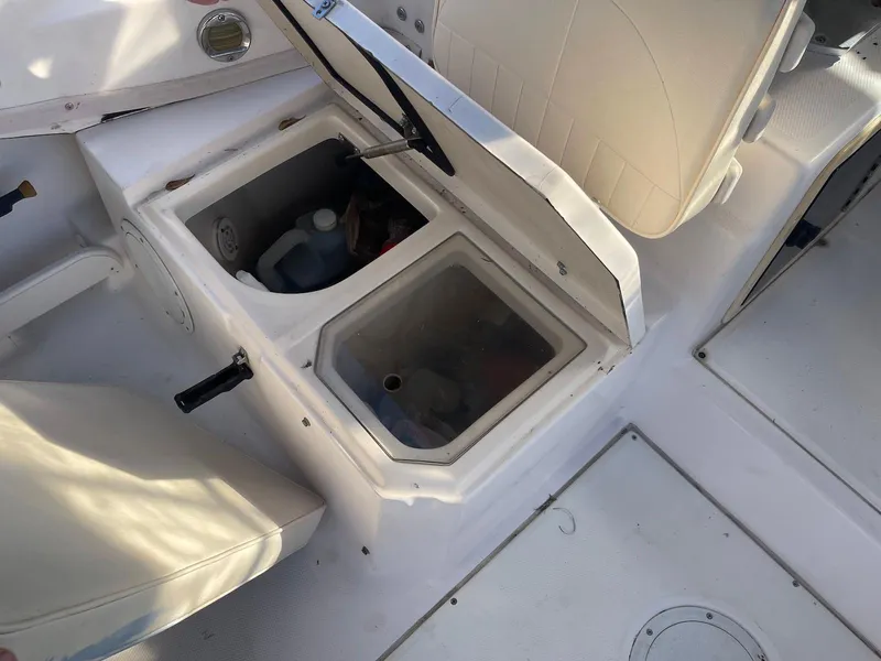 Slide: The Image of 2001 Grady-White Gulfstream 232 boat interior with open storage compartments. - 18