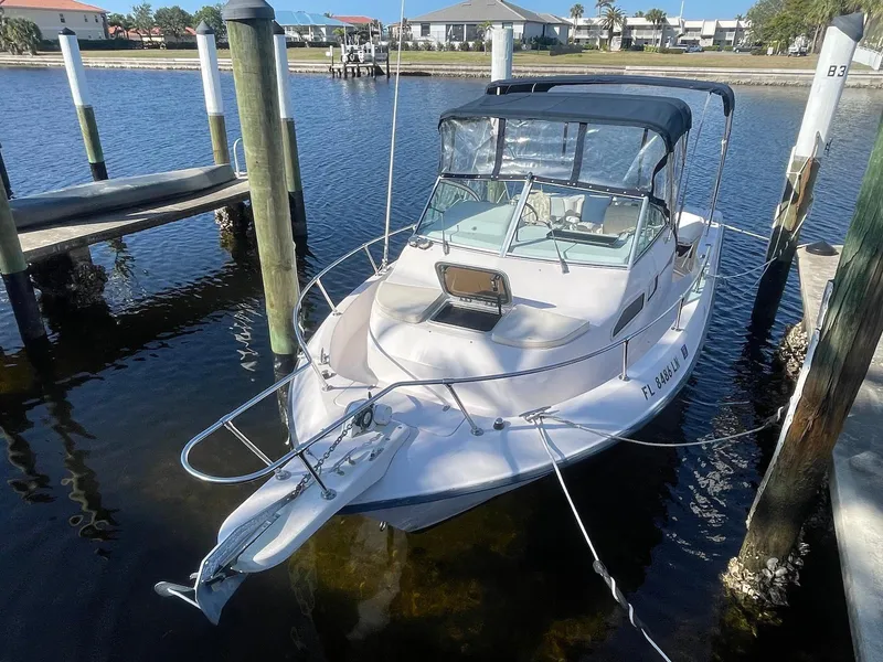 Slide: The Image of 2001 Grady-White Gulfstream 232 boat docked in a marina. - 2