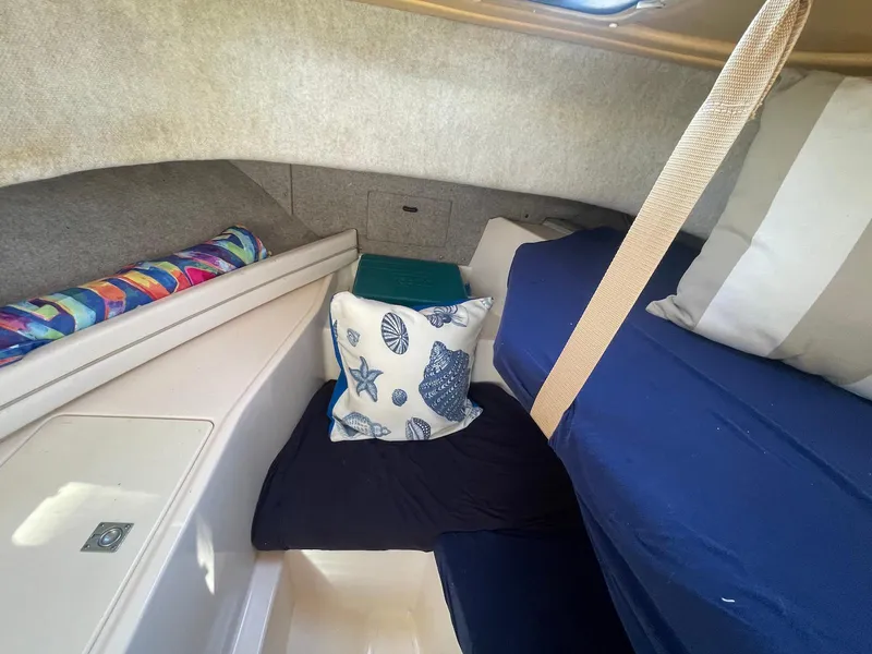 Slide: The Image of Interior cabin of 2001 Grady-White Gulfstream 232 with nautical-themed pillows. - 24