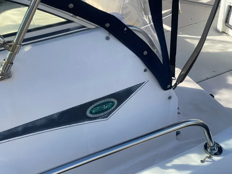 Slide: The Image of 2001 Grady-White Gulfstream 232 boat detail with logo and railing. - 25