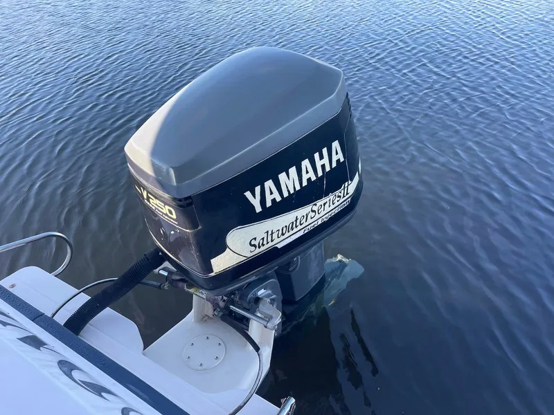 Slide: The Image of Yamaha outboard motor on 2001 Grady-White Gulfstream 232 in calm water. - 26