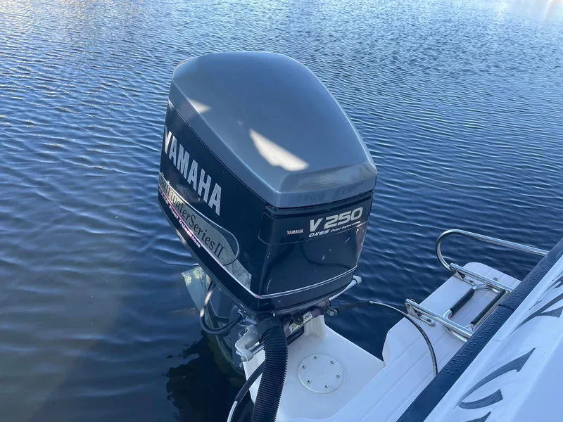 Slide: The Image of Yamaha V250 outboard motor on 2001 Grady-White Gulfstream 232 boat in water. - 27
