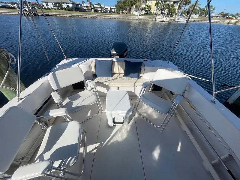 Slide: The Image of 2001 Grady-White Gulfstream 232 boat with seating area on calm water. - 8