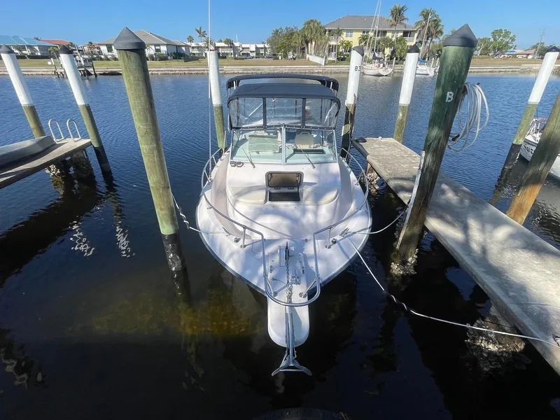 Slide: The Image of 2001 Grady-White Gulfstream 232 boat docked in a marina, front view. - 9